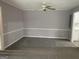 Spacious living room with neutral carpet, ceiling fan, and fresh paint at 2914 Parc Lorraine, Lithonia, GA 30038