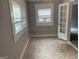 A bright room is shown with neutral colors and tiled floors, with several windows at 2914 Parc Lorraine, Lithonia, GA 30038