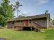 Backyard of home features wood deck and plenty of yard space at 170 Hidden Pines Drive, Covington, GA 30016