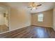 An additional bedroom with wood-look floors, neutral walls, and a window at 170 Hidden Pines Drive, Covington, GA 30016