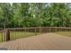 A large, well-maintained deck overlooking a lush, green backyard providing privacy and a peaceful atmosphere at 170 Hidden Pines Drive, Covington, GA 30016
