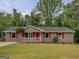 Charming single-story home with a well-maintained lawn and a welcoming front porch at 170 Hidden Pines Drive, Covington, GA 30016