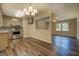 Eat-in kitchen area showcasing modern appliances, countertops and fixtures with view into living area at 170 Hidden Pines Drive, Covington, GA 30016
