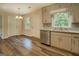 Updated kitchen area with stainless steel appliances, modern countertops, and ample cabinet space at 170 Hidden Pines Drive, Covington, GA 30016