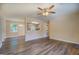 Open-concept living area with modern flooring and a view into the kitchen area at 170 Hidden Pines Drive, Covington, GA 30016