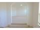 Elegant archway leads to a bright, carpeted room, adding architectural interest at 524 Harmony Way, Locust Grove, GA 30248