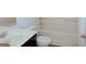 Bright bathroom featuring white fixtures, a soaking tub and chrome hardware at 524 Harmony Way, Locust Grove, GA 30248