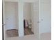 Bathroom view highlighting stylish paneled doors leading to a clean, bright interior at 524 Harmony Way, Locust Grove, GA 30248