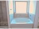 Bathroom showcasing soaking tub with tile accents and an adjacent shower at 524 Harmony Way, Locust Grove, GA 30248
