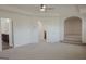Spacious bedroom with ensuite bathroom and archway leading to another room at 524 Harmony Way, Locust Grove, GA 30248