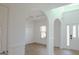 Elegant dining area showcasing an archway, decorative wall trim, and a stylish chandelier, creating a refined ambiance at 524 Harmony Way, Locust Grove, GA 30248