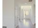 Bright and spacious foyer featuring white walls, archways, and wood-look flooring, leading to the main entrance at 524 Harmony Way, Locust Grove, GA 30248