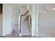 Foyer with a staircase, adjacent rooms, and modern flooring for an inviting entrance at 524 Harmony Way, Locust Grove, GA 30248