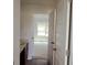 Hallway view into bath and bedroom with natural light at 524 Harmony Way, Locust Grove, GA 30248