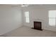 Inviting living room featuring a fireplace and large windows for ample natural light at 524 Harmony Way, Locust Grove, GA 30248