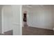 Open-concept living space featuring a light and airy atmosphere with white walls and modern vinyl plank flooring at 524 Harmony Way, Locust Grove, GA 30248