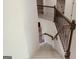 Open staircase with decorative wrought iron spindles leads to the upper level at 524 Harmony Way, Locust Grove, GA 30248