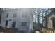 Exterior view of a new construction home showcasing modern design and clean lines, surrounded by a natural landscape at 1301 Lavista Ne Rd, Atlanta, GA 30324