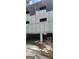 Unfinished exterior of a house showcasing the framework, with missing drywall and windows at 1301 Lavista Ne Rd, Atlanta, GA 30324
