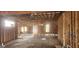 Unfinished interior with exposed studs and beams; sunlight streams through openings for windows, illuminating the space at 1301 Lavista Ne Rd, Atlanta, GA 30324