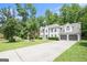 Elegant two-story home with a two-car garage, lush landscaping, and spacious driveway at 1478 Interlaken Pass, Jonesboro, GA 30238