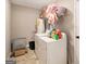 The laundry room includes a washing machine, dryer, and shelving for storage at 1478 Interlaken Pass, Jonesboro, GA 30238