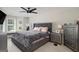 Cozy bedroom with a large bed, TV, windows, and neutral decor at 1478 Interlaken Pass, Jonesboro, GA 30238
