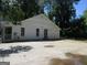 Spacious backyard featuring a large concrete patio at 4382 Highway 42 S, Locust Grove, GA 30248