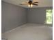 Spacious bedroom with natural light and a ceiling fan at 4382 Highway 42 S, Locust Grove, GA 30248