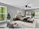 Bright bedroom with large windows, neutral decor, and a comfortable bed, designed for relaxation at 4382 Highway 42 S, Locust Grove, GA 30248