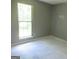 Bright bedroom featuring a large window offering natural light at 4382 Highway 42 S, Locust Grove, GA 30248