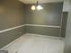 Empty dining room with unfinished floors, neutral walls, and a modern chandelier at 4382 Highway 42 S, Locust Grove, GA 30248