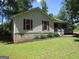 Charming single-story home with red shutters, and a cozy front porch at 4382 Highway 42 S, Locust Grove, GA 30248