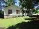 Well-maintained front lawn and home's cozy front porch at 4382 Highway 42 S, Locust Grove, GA 30248