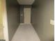 Narrow hallway with gray walls leading to the front door at 4382 Highway 42 S, Locust Grove, GA 30248