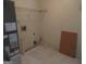 Cozy laundry room with washer/dryer hookups and shelving at 4382 Highway 42 S, Locust Grove, GA 30248
