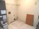 Laundry room with hookups and space for appliances and featuring unfinished flooring at 4382 Highway 42 S, Locust Grove, GA 30248