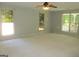 Unfurnished living room with ceiling fan and ample natural light at 4382 Highway 42 S, Locust Grove, GA 30248
