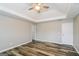 Bedroom with ceiling fan, trey ceiling, and wood-look flooring at 2577 Shropshire Pl, Mcdonough, GA 30253
