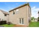 Back exterior featuring a concrete patio, air conditioning unit, and well-maintained lawn at 2577 Shropshire Pl, Mcdonough, GA 30253