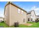 Back exterior featuring a concrete patio, air conditioning unit, and well-maintained lawn at 2577 Shropshire Pl, Mcdonough, GA 30253