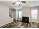 A cozy living room featuring a fireplace and hardwood floors at 2577 Shropshire Pl, Mcdonough, GA 30253