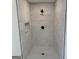 Modern shower features marbled tile, black fixtures, and convenient inset shelf at 3339 Clevemont Ct, Ellenwood, GA 30294