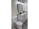 Bright bathroom with double vanity, granite countertop, modern mirrors, lighting, and fixtures at 3339 Clevemont Ct, Ellenwood, GA 30294