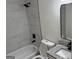 Updated bathroom featuring marble-look shower, updated toilet, tub, vanity and fixtures at 3339 Clevemont Ct, Ellenwood, GA 30294
