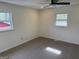 Bright bedroom featuring neutral walls, carpet, and two windows for plenty of natural light at 3339 Clevemont Ct, Ellenwood, GA 30294
