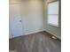 Bedroom features neutral walls, carpet, and a window letting in natural light at 3339 Clevemont Ct, Ellenwood, GA 30294