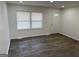Living room with luxury vinyl plank flooring, a white door and lots of natural light at 3339 Clevemont Ct, Ellenwood, GA 30294
