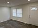 Bright living room with luxury vinyl plank flooring and an exterior door at 3339 Clevemont Ct, Ellenwood, GA 30294
