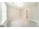Bedroom with carpeted floors, a window allowing natural light and a view to another room at 1577 Keystone Dr, Conley, GA 30288